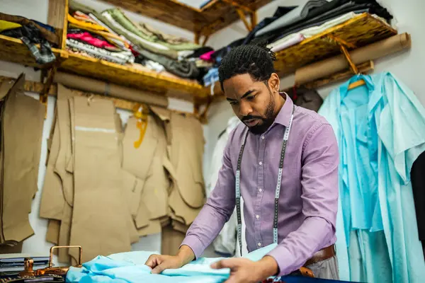 Male African American Tailor His Atelier Folding Fabric — Stock Photo, Image