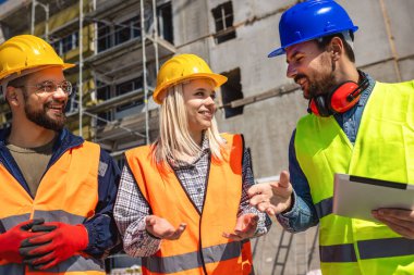 Construction team planning a building blueprint project on site with collaboration for architect innovation. Architecture, design and engineers with teamwork for successful  clipart