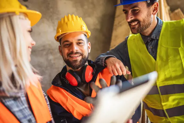 Construction team planning a building blueprint project on site with collaboration for architect innovation. Architecture, design and engineers with teamwork for successful industrial renovation.