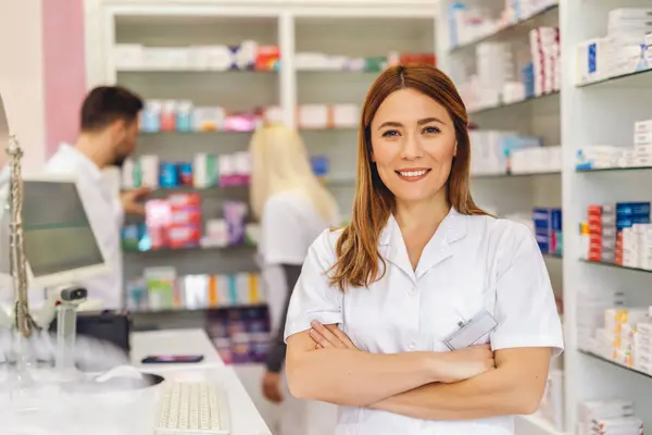 Smiling Portrait Young Beautiful Female Pharmacist Standing Cash Desk Crossed — Stock Photo, Image