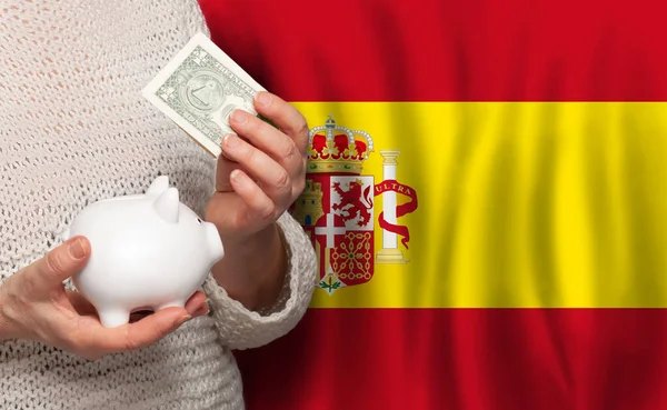 带着西班牙国旗背景下的储蓄罐的西班牙女人Dotations Pension Fund Poverty Wealth Retirement Concept — 图库照片