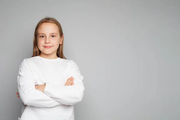 Smart Playful Kid Schoolgirl Posing Crossed Arms Closeup Studio Portrait — Stock Photo, Image