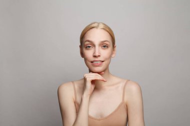 Spa woman smiling on white background. Facial treatment, cosmetology, skincare and beauty concept