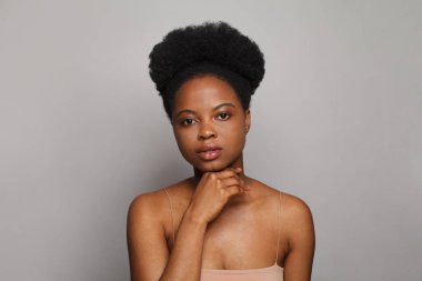 Portrait of young woman with fresh shiny dark skin