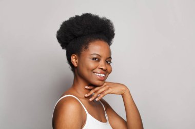 Cheerful model woman with dark clean fresh smooth skin portrait. Cute female face