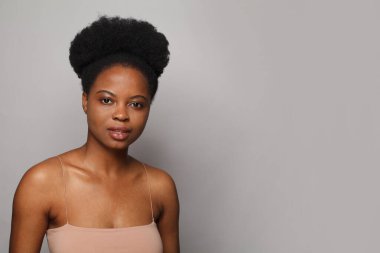 Perfect woman with fresh clean skin posing on white studio wall background. Beauty, facial treatment, skin care and wellness concept