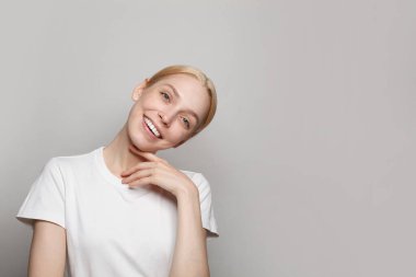 Portrait of  nice cool attractive lovely cheerful woman isolated on grey background
