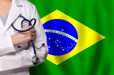 Brazilian medicine and healthcare concept. Doctor close up against flag of Brazil background