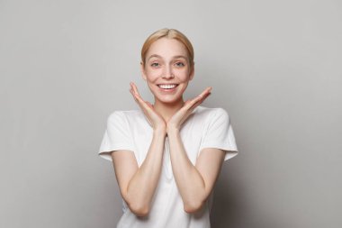 Photo of charming nice cute beautiful attractive model woman shocked by someone excited isolated over light grey background