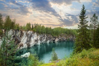Beautiful landscape of cloudy sunset and cold blue mountain river