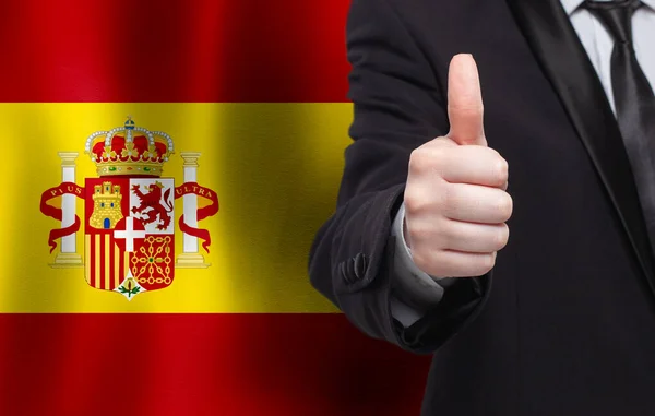 Испанский Концепт Бизнесмен Показывающий Большой Палец Фоне Флага Испании — стоковое фото