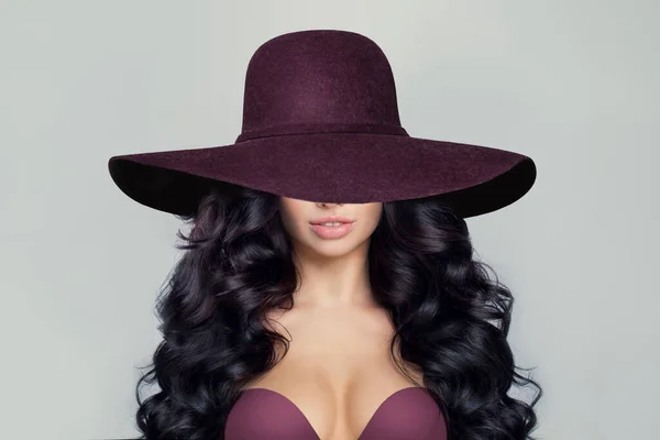 stock image Beautiful Model Woman with Curly Hairstyle in wide purple broad brim hat