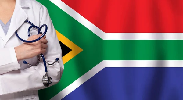 stock image South Arfrican medicine and healthcare concept. Doctor close up against flag of South Africa background