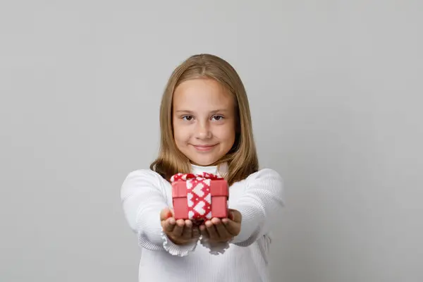 Happy Smiling Child Girl Giving Red Gift Box White Background — стоковое фото