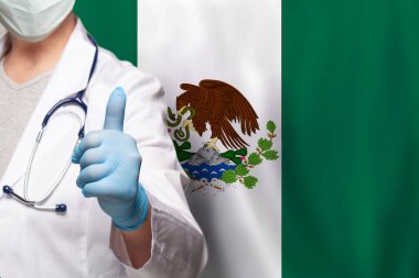 Meksikalı doktorun eli Meksika bayrağında olumlu bir hareket sergiliyor.