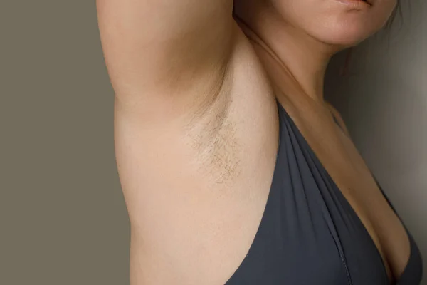 Hair armpit. Woman body closeup