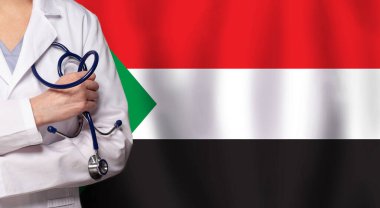 Sudan tıbbı ve sağlık hizmeti konsepti. Doktor, Sudan bayrağına yaklaşın.