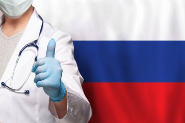 Rus doktorun eli Rusya 'nın bayraklarında olumlu bir hareket gösteriyor.