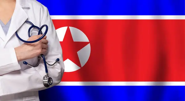 Medicina Norcoreana Concepto Salud Doctor Cerca Contra Bandera Rpdc Fotos de stock libres de derechos