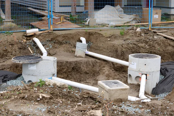 General view of sewers under construction in a residential neighborhood.