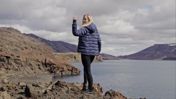 Blond Woman Stretching Rocks Sea — стокове відео