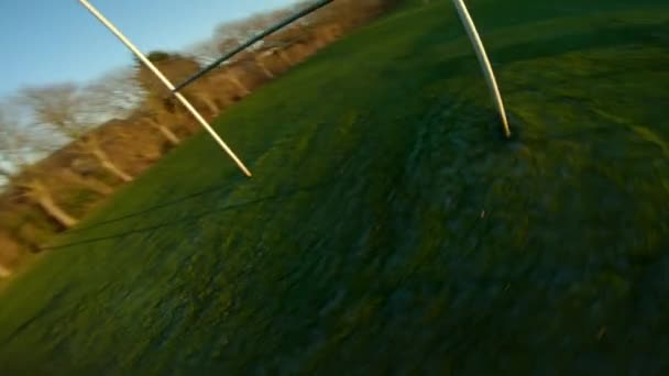 Racing Drone Flying Rugby Goalpost Doing Spinning Aerial Tricks Daytime — Stock Video