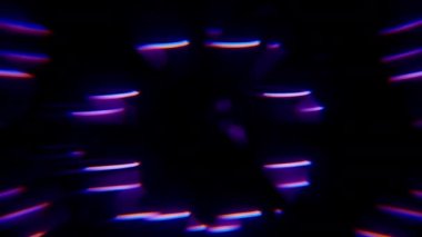 Mor spot ışıklarına odaklanmış, havadan bir çemberin tabanına dokunan bir kadını gösteren, kopya ve bulanık efektli bir video.