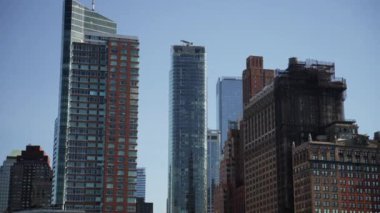 A video showing buildings in Manhattan which include 50 West Street, Residences at Ritz-Carlton, and Whitehall Building Annex during daytime