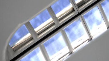 A video starting in slow motion and ends in fast motion of the skylight of the Oculus at the World Trade Center during daytime