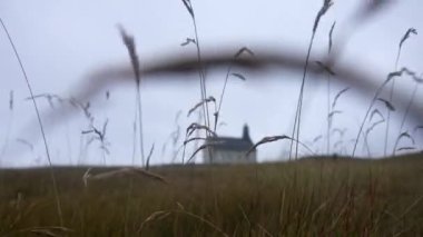 Low angle shot from the ground showing the Strandarkirkja church in Iceland