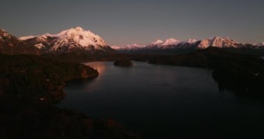 An aerial view of Tronador mountain and the lake at Bariloche, Argentina during dawn