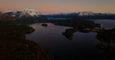 An aerial view of Tronador mountain and the lake at Bariloche, Argentina during dawn