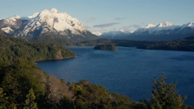 A still shot of the Nahuel Huapi lake and snow-capped Tronador mountain at Bariloche, Argentina during daytime