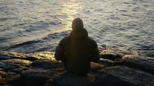 Wide Shot Showing Man Sitting Looking Lakeshore Bariloche Argentina Sunrise — ストック動画