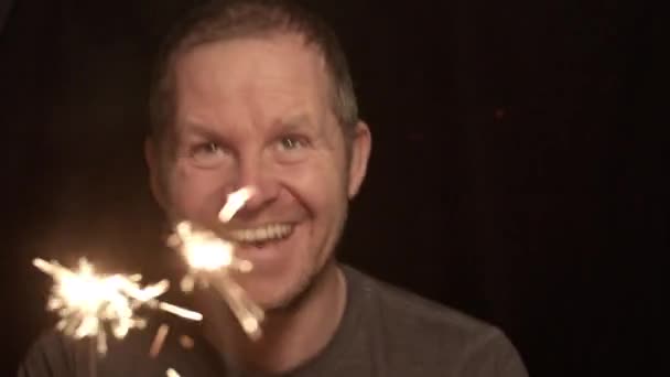 Close Shot Excited Man Having Fun Sparklers Holding Dark Background — Stok video