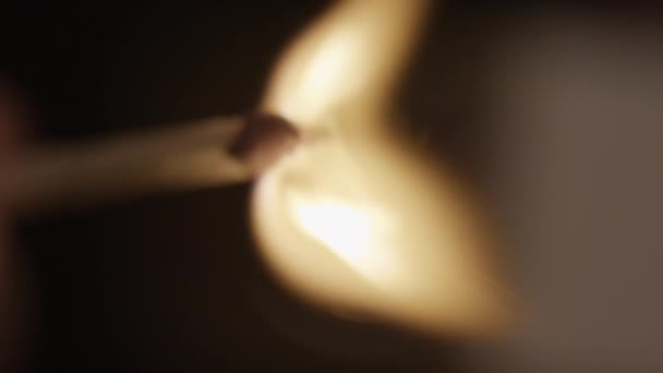 Close Shot Blurry Burning Matchstick Slowly Goes Focus Blurred Background — Stock Video