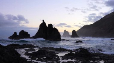 Sunset over the rocky seashore and sea stacks at the Benijo beach in Tenerife, Spain