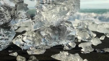 The rushing waves and melting ice on Diamond Beach's black sand
