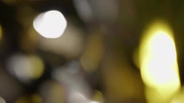 Close Shot Black Background Falling Shiny Confetti Bokeh Effect — Stockvideo