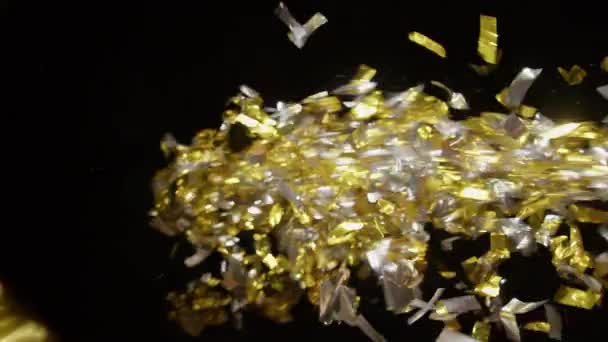 Gold Silver Confetti Blast Bursting Right Side Falling Black Background — Wideo stockowe