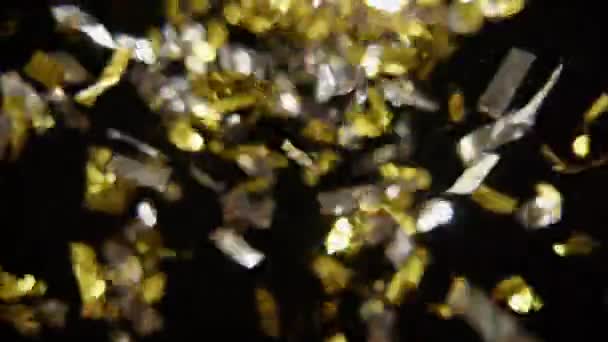 Bunch Silver Gold Confetti Blown Air Black Background — Wideo stockowe
