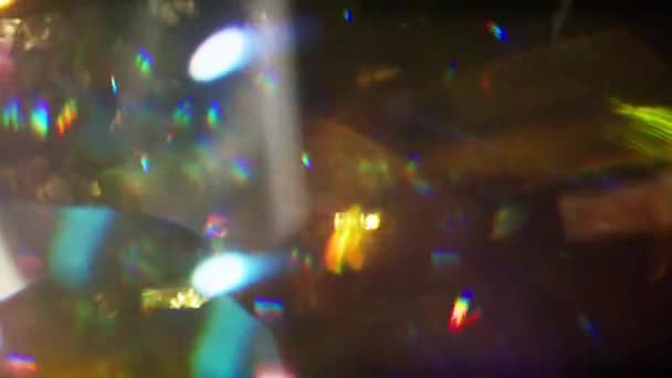 Gold Silver Confetti Falling Black Background Lens Flare Effect — Vídeo de stock