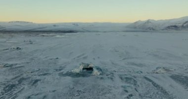 Aerial view of the winter landscape and snow-covered mountains of Iceland during daytime