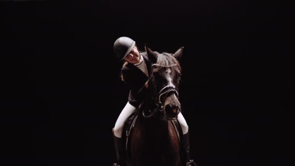 Young Woman Equestrian Riding Horse Front Camera Studio Black Background — Video