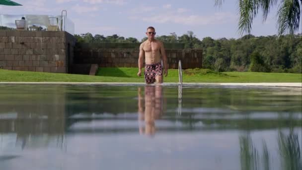 Wearing Sunglasses Trunks Man Wades Water Walks Pool Resort Broad — Stock Video