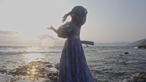 Cliffs Woman Gracefully Dances Her Movements Intertwines Wind Sea — Stock Video