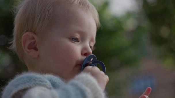 Detailed View Baby Gently Sucking Pacifier — Stock Video