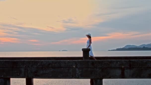 Woman Leisurely Strolls Koh Chang Pier Bathed Warm Hues Sunset — Stock Video
