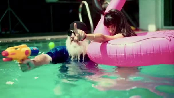 Man Woman Enjoy Daytime Water Gun Fight Float Fun Pool — Stock Video