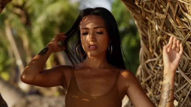 Woman Fierce Expression Her Face Gently Swinging Rattan Chair Beach — Stock Video